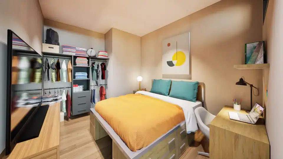 Furnished student bedroom at Luminary with built-in wardrobe, desk and lake-blue bedding