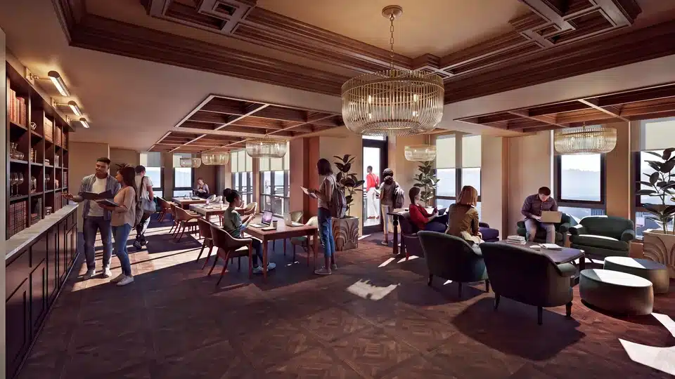 Luminary Sky Lounge with chandeliers, study tables and armchairs overlooking campus